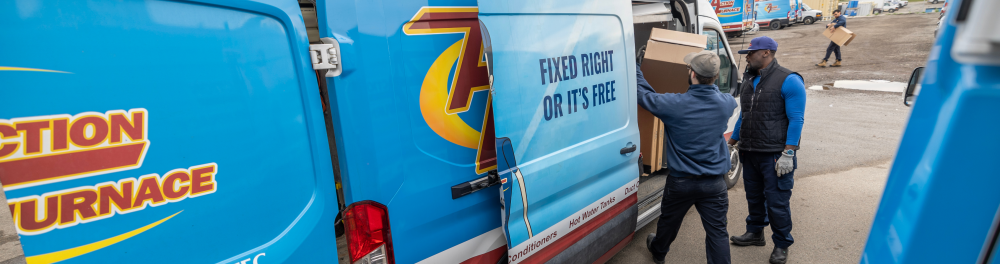 Two Action Furnace technicians load up their van for the day. They will arrive at the job fully prepared for whatever lays ahead.